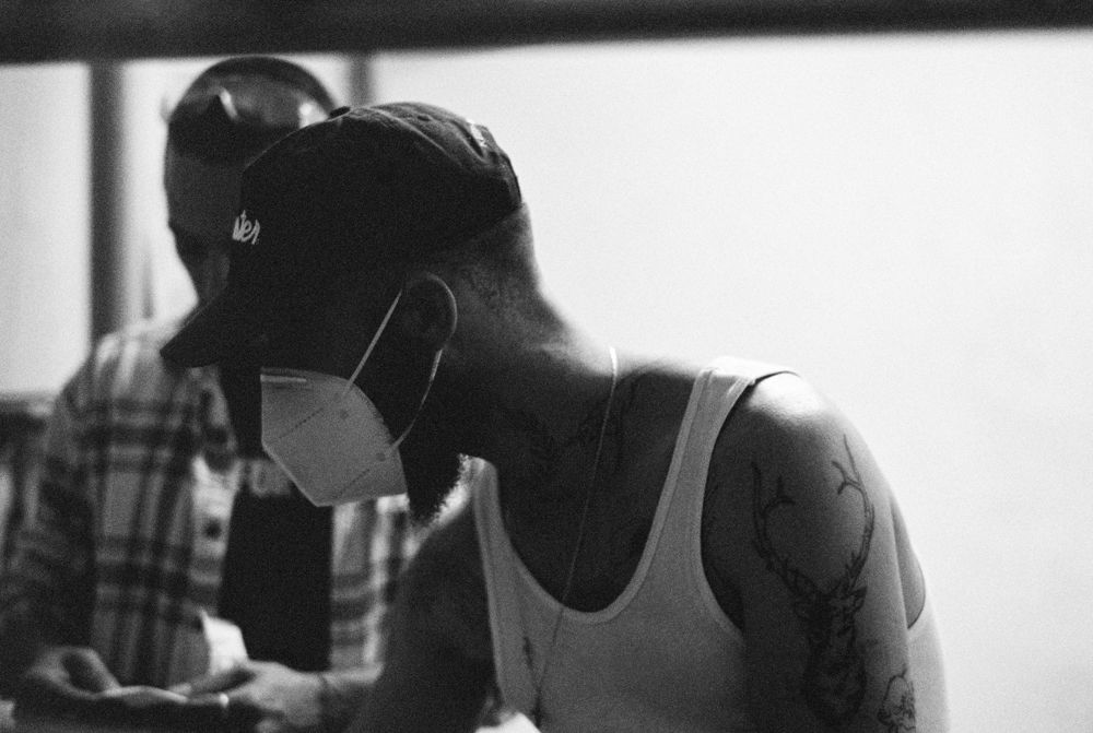 Two builders close over the work, black and white