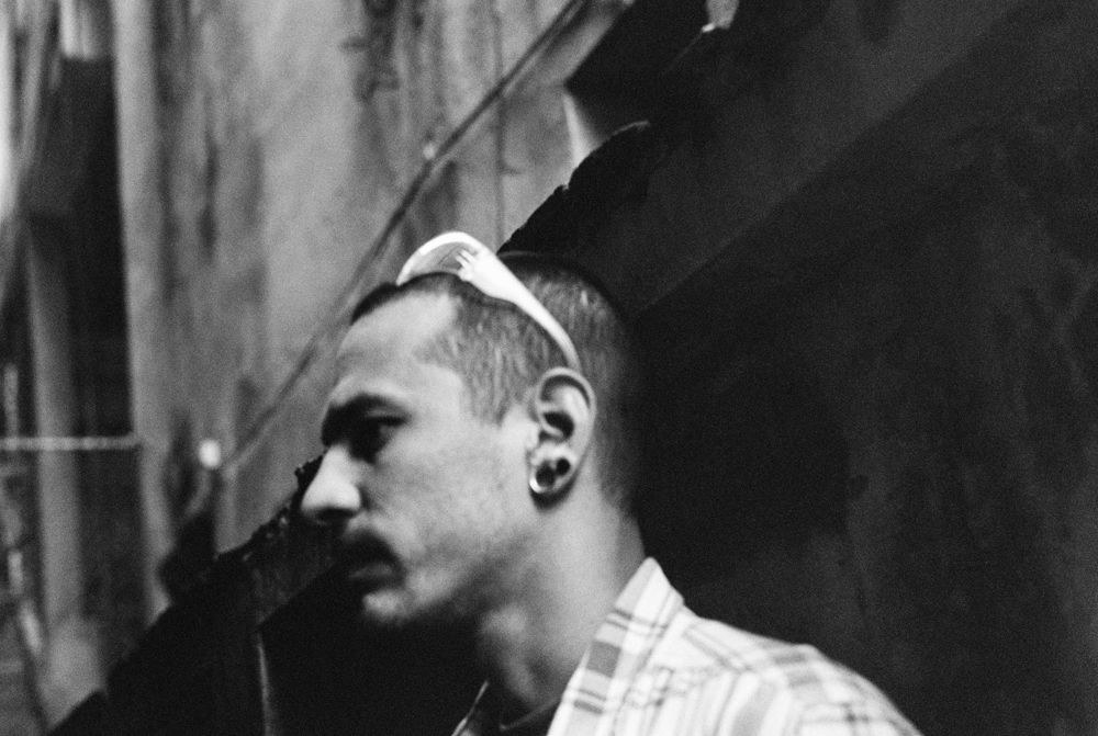 Profile portrait against the dark doorway