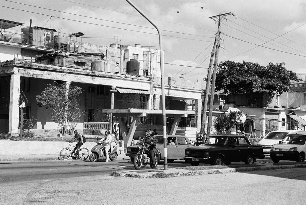 Street with cars and cyclists, black and white