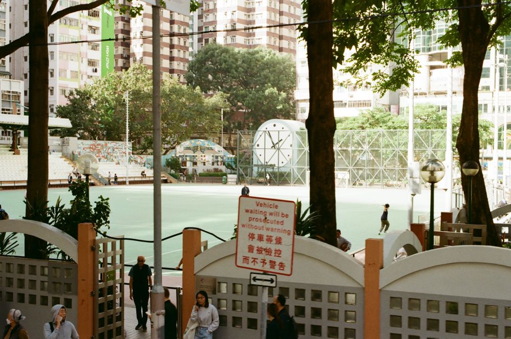Playground court behind painted gates
