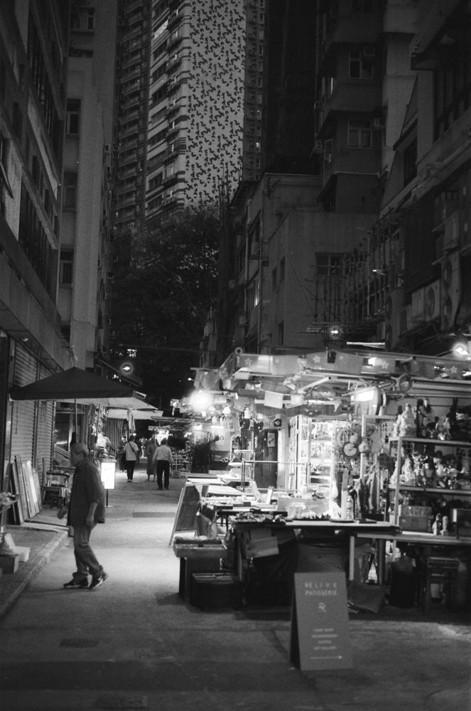 Night market stalls glowing in the dark